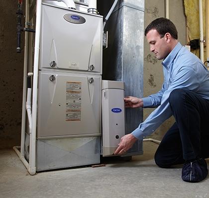 Snazzy technician servicing a residential furnace